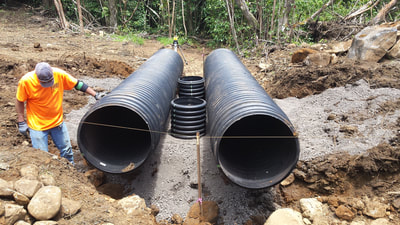 Installation of culvert pipes, private subdivision road, Haiku HI.